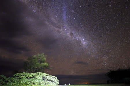 The Milky Way is seen in the sky above a path and huts on Lady Elliot Island located north-east of the town of Bundaberg in Queensland, Australia, June 10, 2015. REUTERS/David Gray