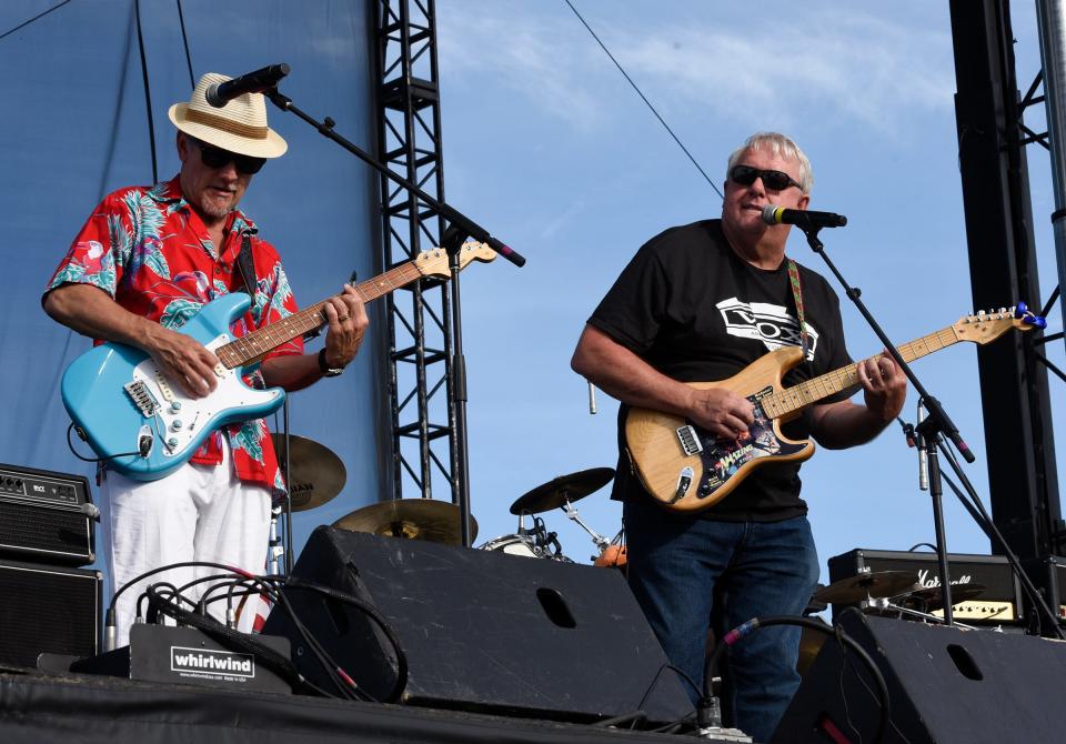 Mark Bragelman, president and CEO of Liberty Bank Minnesota, fills in to sing for The Rockin' Hollywoods, Friday, June 28, 2019 at the 31st Annual Liberty Bank Block Party. 