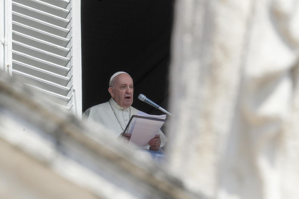 Pope Francis delivers his blessing as he recites the Angelus noon prayer from the window of his studio overlooking St.Peter's Square, at the Vatican, Sunday, Sept. 13, 2020. (AP Photo/Andrew Medichini)