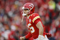 Kansas City Chiefs quarterback Patrick Mahomes (15) reacts after a Chiefs' touchdown during the first half of an NFL divisional playoff football game against the Houston Texans, in Kansas City, Mo., Sunday, Jan. 12, 2020. (AP Photo/Jeff Roberson)