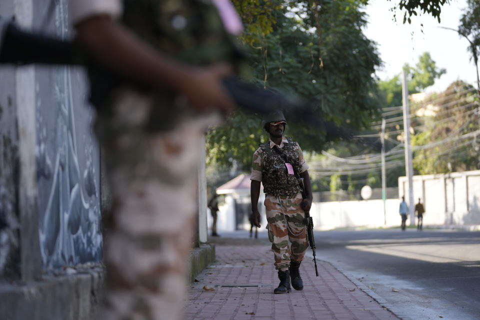 Paramilitary soldiers patrol a street in Jammu, India, Tuesday, Oct. 4, 2022. The prisons chief in Indian-controlled Kashmir has been killed, officials said Tuesday, as India’s powerful home minister arrived in the disputed Himalayan region on a three-day visit. (AP Photo/Channi Anand)