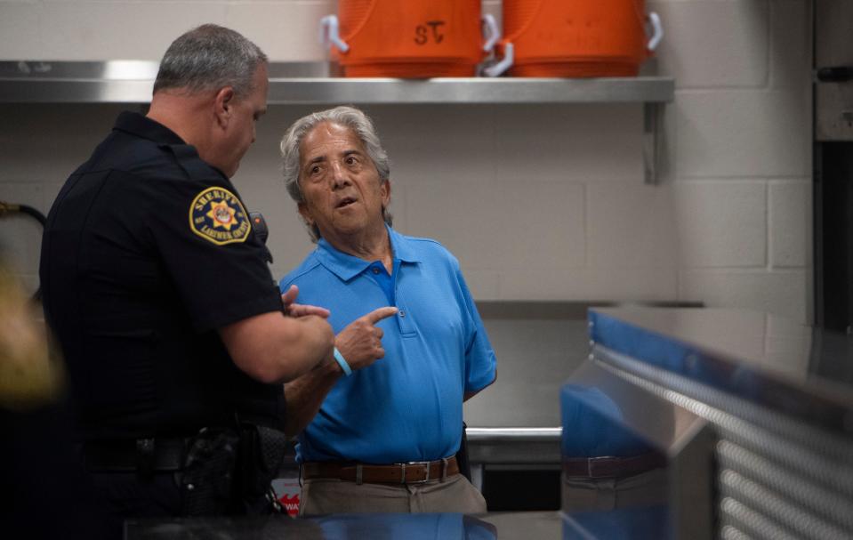 Larimer County commissioner John Kefalas, right, speaks with Larimer County Jail Administrator Captain Bobby Moll during a tour of the new kitchen at the Larimer County Jail in Fort Collins, Colo. on Thursday, July 22, 2021.