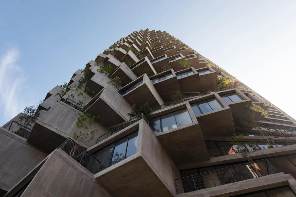 Looking up at the BIG-designed IQON, a residential and commercial structure that's now the tallest building in Quito, Ecuador.