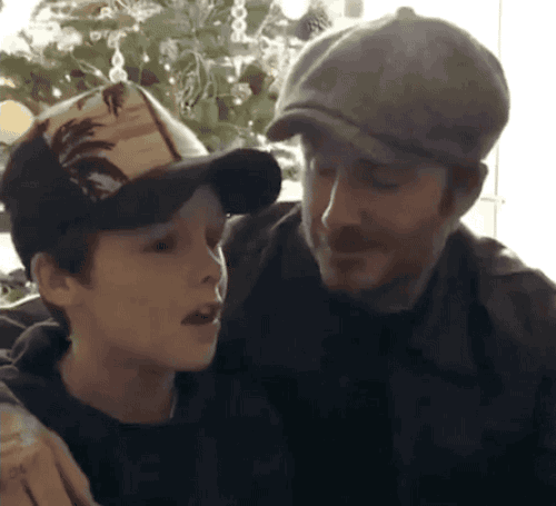 GIF of David Beckham and embarrassed son