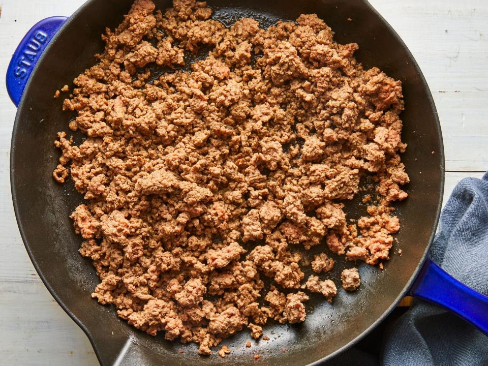 cooked ground beef in a Staub cast iron pan