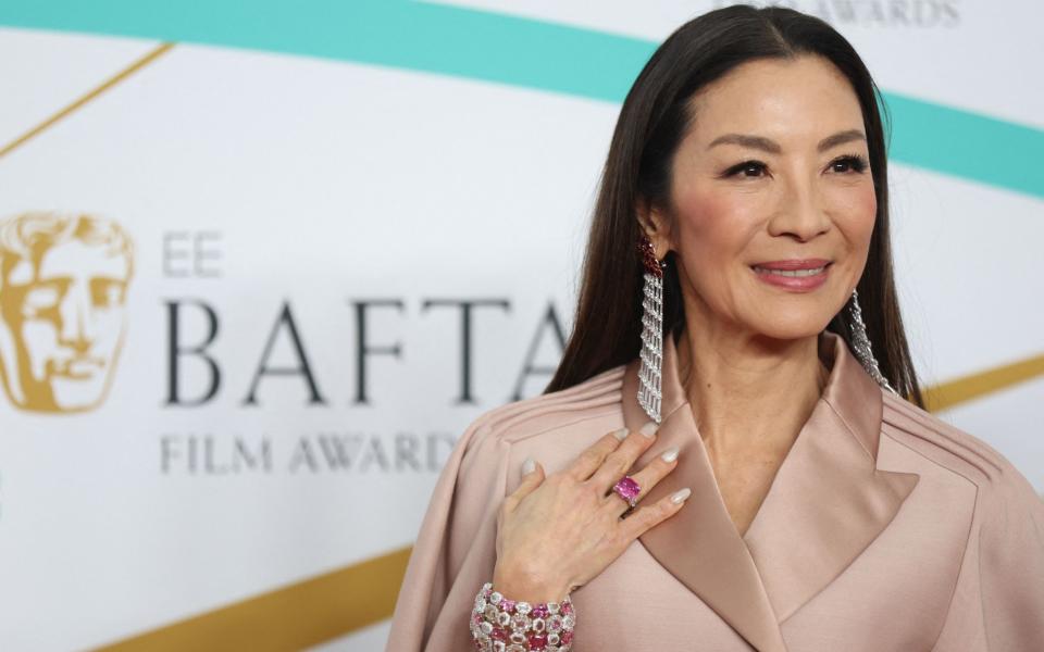 Michelle Yeoh, nominated for Everything Everywhere All At Once, on the Baftas red carpet - ISABEL INFANTES/AFP via Getty 