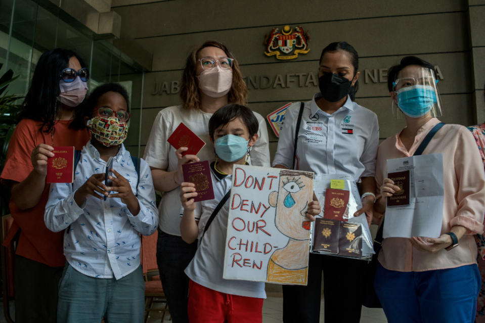 Mothers with their children who were waiting for Malaysian citizenship certificates to be issued by the National Registration Department in Putrajaya February 21, 2022. — Picture by Shafwan Zaidon