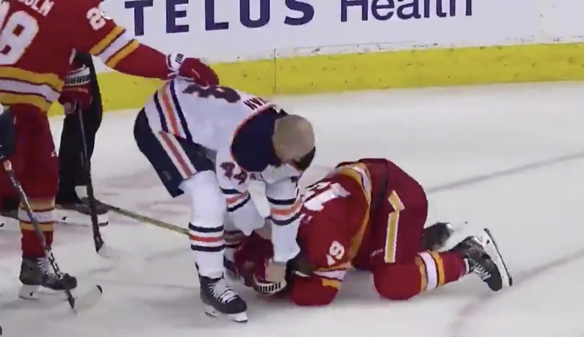 Calgary Flames' Matthew Tkachuk delivers huge hit on Edmonton Oilers' Zack  Kassian, sparking brawl
