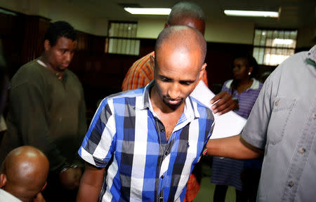Osman Ibrahim is escorted from the Mililani Law Courts where he appeared as a suspect in connection with the attack at the DusitD2 complex, in Nairobi, Kenya January 18, 2019. REUTERS/Thomas Mukoya
