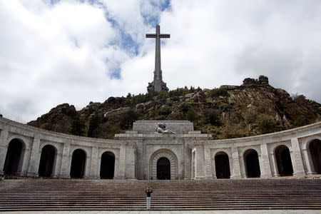 A woman takes pictures at the Valle de los Caidos (Valley of the Fallen) mausoleum where over 30,000 fighters from both sides of Spain's civil war are buried, outside Madrid, Spain, May 11, 2016. REUTERS/Paul Hanna/Files