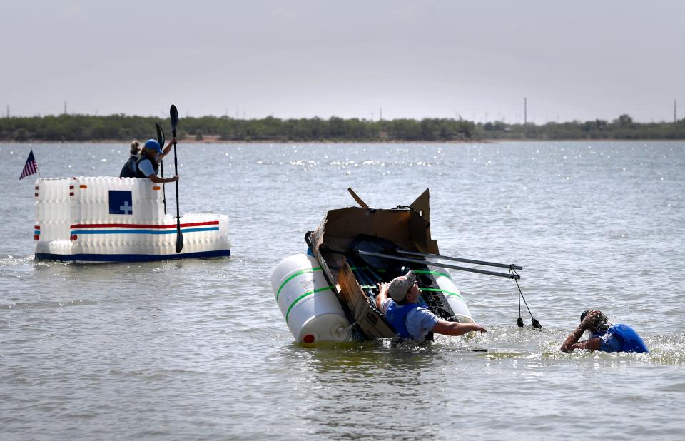 Justin Anderson joins his teammate Daniel Kaufmann as they fall from the back of their recycled boat, the Bullship. The men were racing for the Toro Company.
