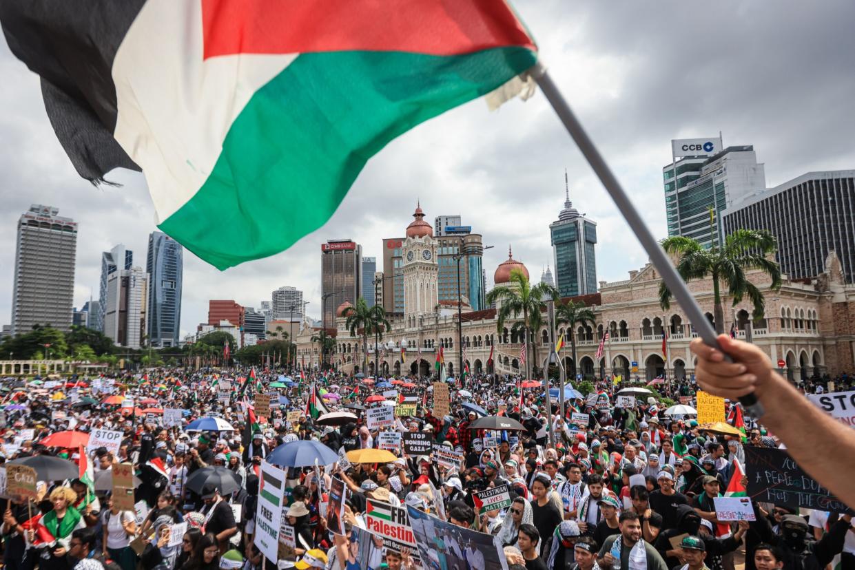 KUALA LUMPUR - OCTOBER 22: People gather during a Freedom for Palestine rally at Merdeka Square on October 22, 2023, in Kuala Lumpur, Malaysia. On October 7, the Palestinian militant group Hamas launched the largest surprise attack from Gaza in a generation, sending thousands of missiles and an unknown number of fighters by land, who shot and kidnapped Israelis in communities near the Gaza border. The attack prompted retaliatory strikes on Gaza and a declaration of war by the Israeli prime minister. (Photo by Annice Lyn/Getty Images)