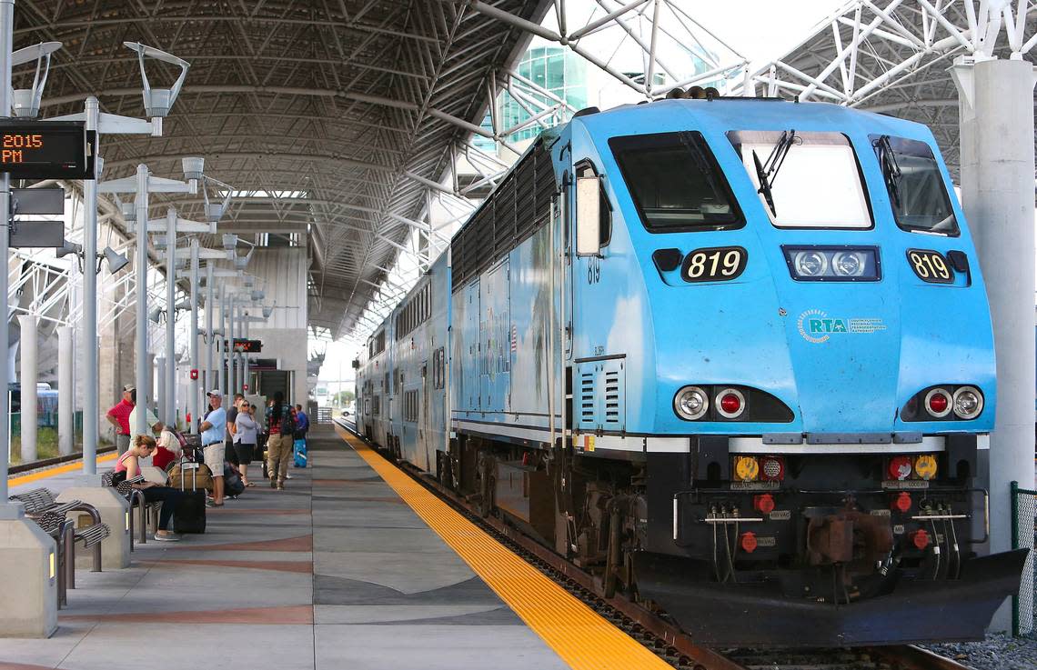 A view of people waiting at Miami Airport Tri-Rail Station in Miami on Friday, Nov. 6, 2015.