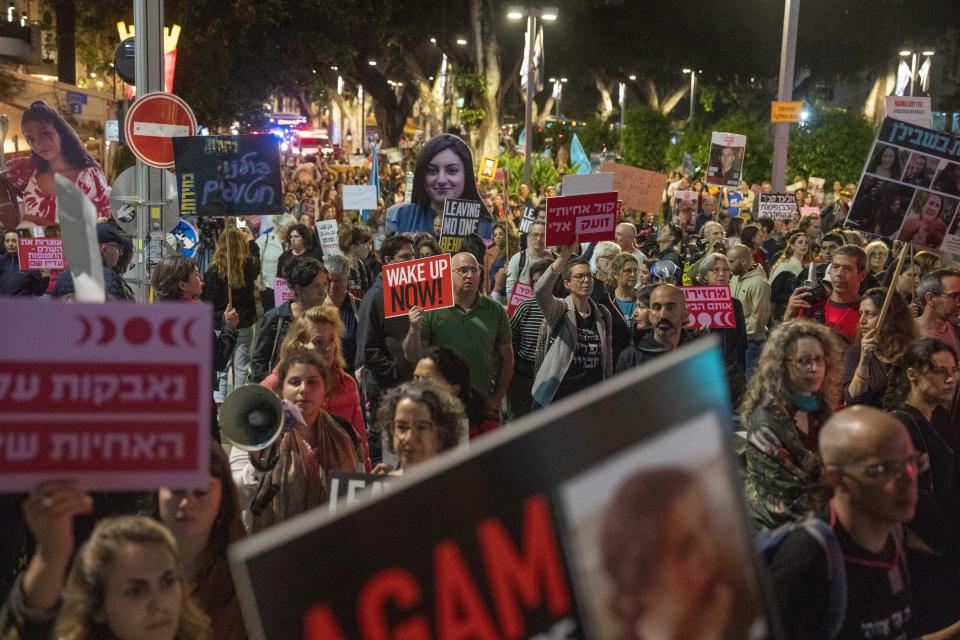 People protest against Israeli Prime Minister Benjamin Netanyahu's government and call for the release of hostages held in the Gaza Strip by the Hamas militant group in Tel Aviv, Israel, Thursday, April 11, 2024. (AP Photo/Ariel Schalit)