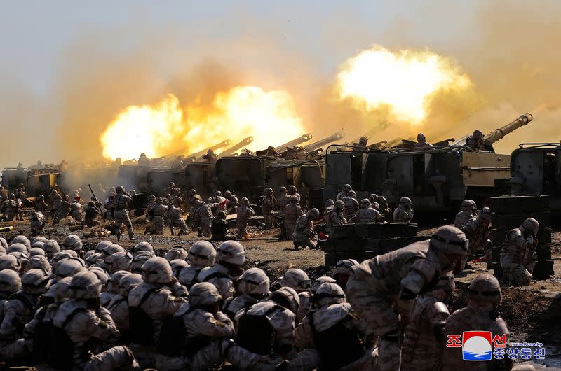 North Korean leader Kim Jong Un guides an artillery firing drill by the Korean People's Army