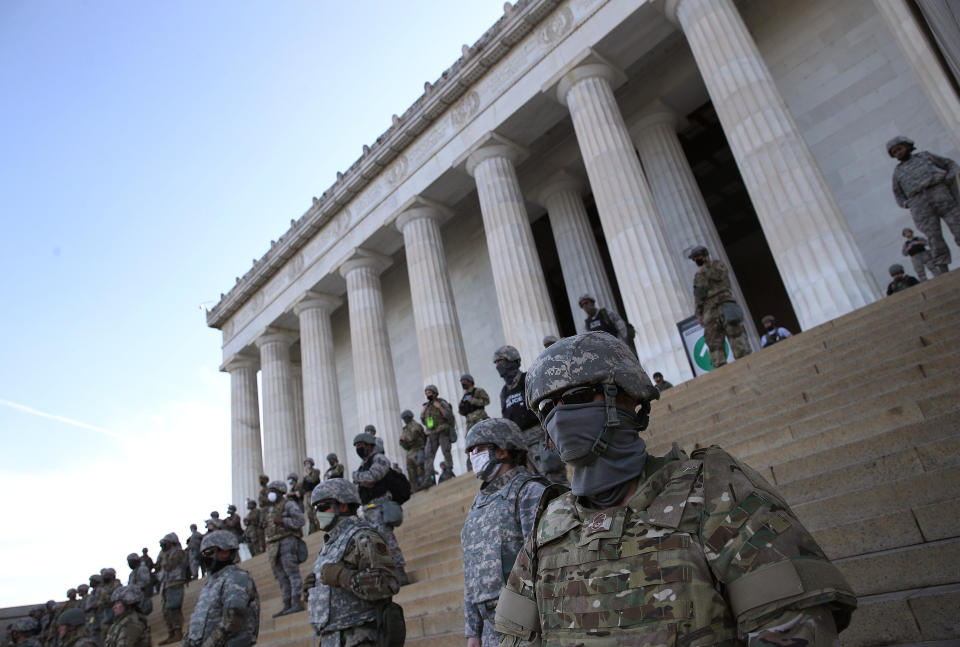 Members of the D.C. National Guard stand on the steps of the Lincoln Memorial as demonstrators participate in a peaceful protest against police brutality and the death of George Floyd. (Photo: Win McNamee via Getty Images)