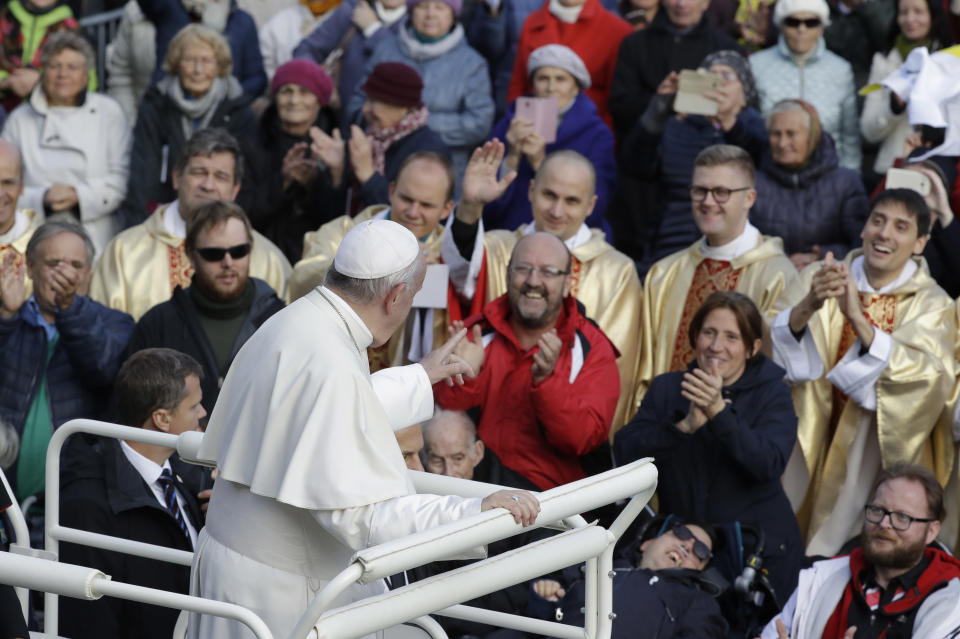 Pope Francis salutes faithful as he arrives in Freedom Square to celebrate a Mass in Tallinn, Estonia, Tuesday, Sept. 25, 2018. Pope Francis concludes his four-day tour of the Baltics visiting Estonia. (AP Photo/Andrew Medichini)