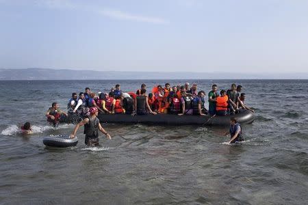 Syrian refugees arrive on a dinghy on the Greek island of Lesbos, September 7, 2015. REUTERS/Dimitris Michalakis