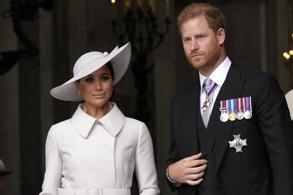 Prince Harry and Meghan Markle, Duke and Duchess of Sussex leave after a service of thanksgiving for the reign of Queen Elizabeth II at St Paul's Cathedral in London, Friday, June 3, 2022 on the second of four days of celebrations to mark the Platinum Jubilee. The events over a long holiday weekend in the U.K. are meant to celebrate the monarch's 70 years of service. (AP Photo/Matt Dunham, Pool)