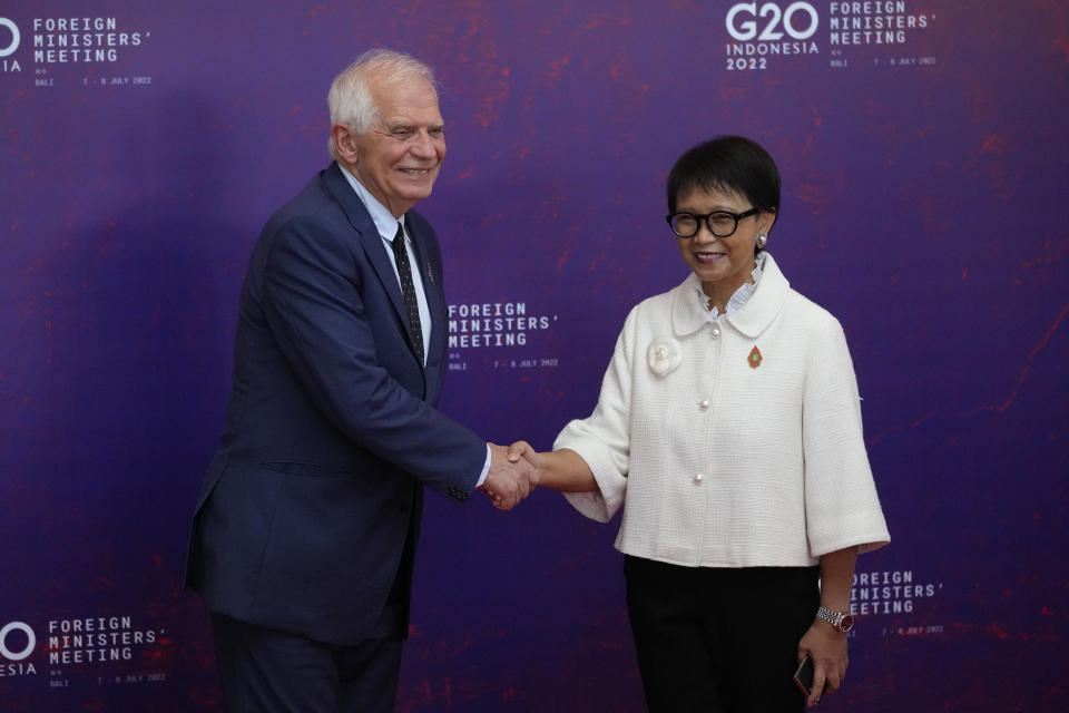 Indonesian Foreign Minister Retno Marsudi, right, greets European Union High Representative for Foreign Affairs and Security Policy Josep Borrell Fontelles upon arrival at the G20 Foreign Ministers' Meeting in Nusa Dua, Bali, Indonesia, Friday, July 8, 2022. (AP Photo/Dita Alangkara, Pool)