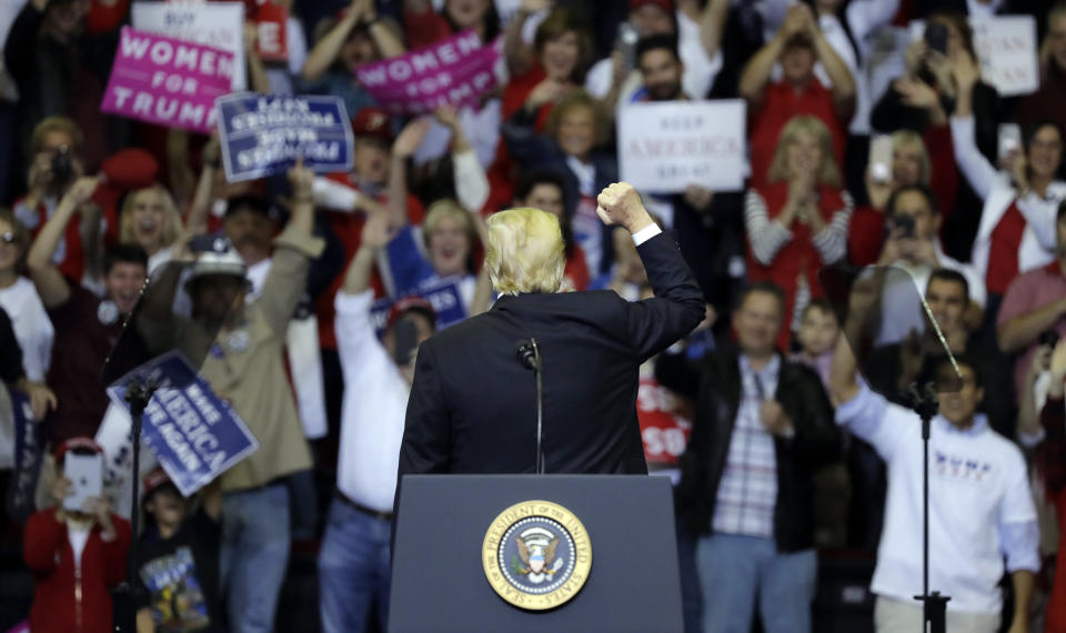 President Donald Trump acknowledges the crowd during a campaign rally, Monday, Oct. 22, 2018, in Houston. (AP Photo/Eric Gay)