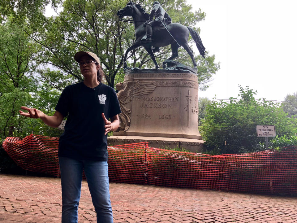 Jalane Schmidt talks in front of a Charlottesville monument to Stonewall Jackson, right in front of a courthouse in town. (Photo: Andy Campbell/HuffPost)