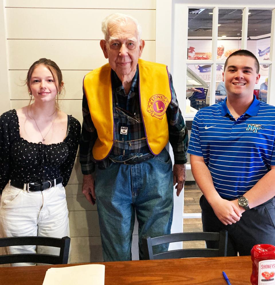 Lion Larry Losh, center, was the chairman of the committee that awarded scholarships to five Oak Ridge High School graduates. He is pictured with two of them who attended a recent meeting. Josephine Hatch, left, and Spencer Shults, right.