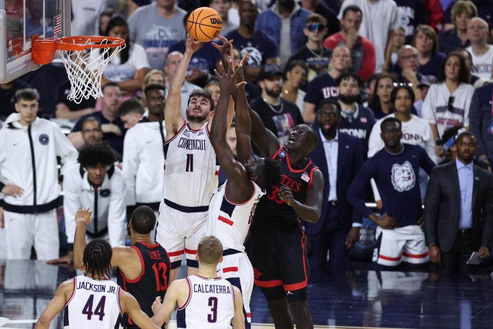 Connecticut forward Alex Karaban (11) goes up for a rebound against San Diego State during the national championship game of the 2023 NCAA men's tournament at NRG Stadium.