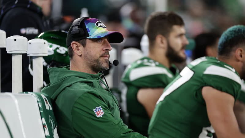 New York Jets quarterback Aaron Rodgers sits on the bench during a game against the Philadelphia Eagles on Sunday, Oct. 15, 2023, in East Rutherford, N.J.