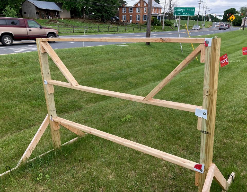 A frame along Sharpsburg Pike near College Road stands empty Tuesday morning after a Derek Harvey campaign sign was stolen. Harvey reported that and similar recent thefts to police.