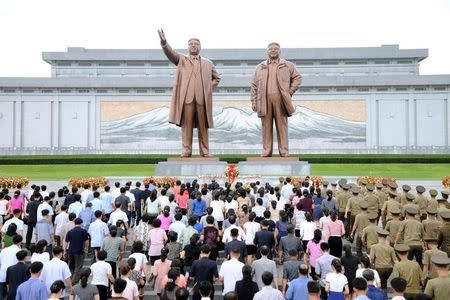 Servicepersons of the Korean People's Army (KPA) and the Korean People's Internal Security Forces (KPISF), civilians, school youth and children visited the statues of President Kim Il Sung and leader Kim Jong Il on the occasion of the 72nd anniversary of national liberation in this undated photo released by North Korea's Korean Central News Agency (KCNA) on August 15, 2017. KCNA/via REUTERS