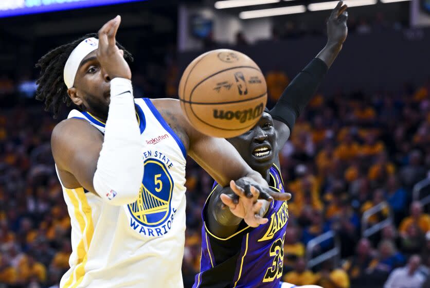 San Francisco, CA - MAY 04: Golden State Warriors forward Kevon Looney, left, and Los Angeles Lakers forward Wenyen Gabriel.