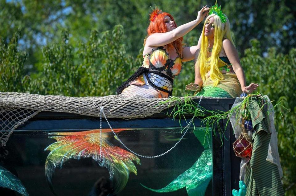 Watkins, left, adjusts the tiara of Mermaid Citrise, Nicole Loudon, during the video shoot for Watkins’ company. Tammy Ljungblad/tljungblad@kcstar.com