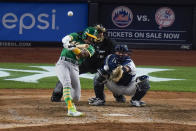 Oakland Athletics' Tony Kemp hits a three-run home run during the sixth inning of the team's baseball game against the New York Yankees Friday, June 18, 2021, in New York. (AP Photo/Frank Franklin II)