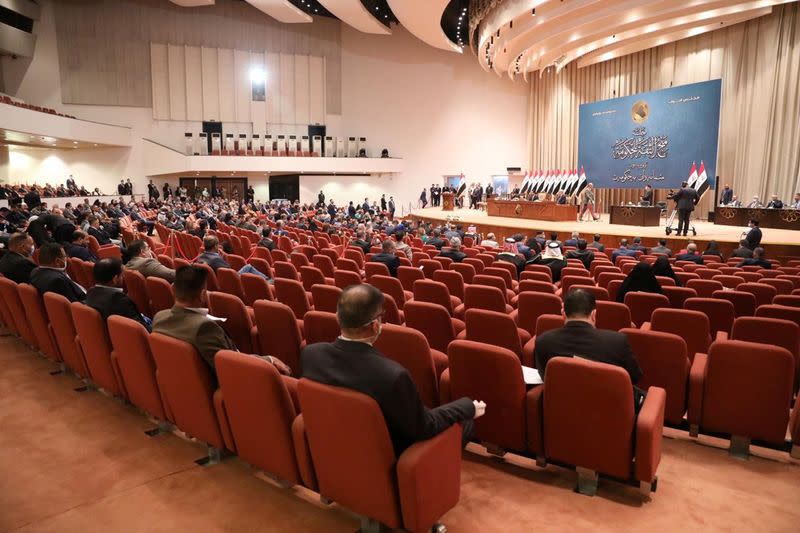 Members of the Iraqi parliament gather before the vote on new government, in Baghdad