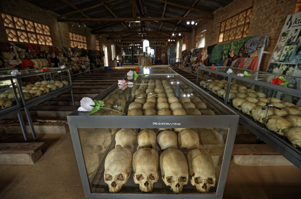 Skulls of some of those who were slaughtered as they sought refuge in the church sit in glass cases, kept as a memorial to the thousands who were killed in and around the Catholic church during the 1994 genocide, inside the church in Ntarama, Rwanda Friday, April 5, 2019. Rwanda will commemorate on Sunday, April 7, 2019 the 25th anniversary of when the country descended into an orgy of violence in which some 800,000 Tutsis and moderate Hutus were massacred by the majority Hutu population over a 100-day period in what was the worst genocide in recent history. (AP Photo/Ben Curtis)