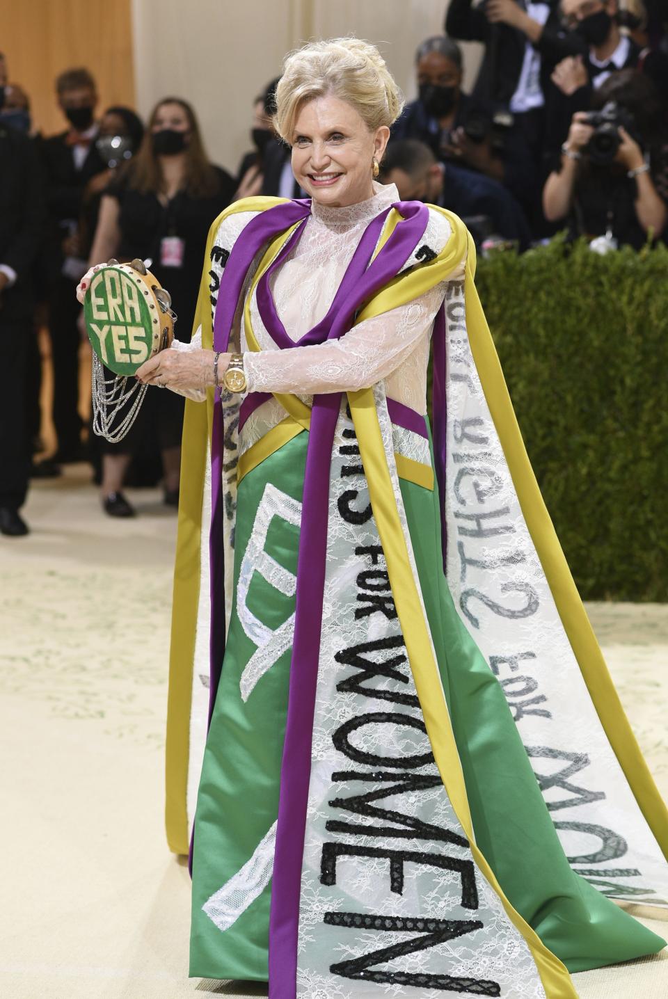 Carolyn B. Maloney with drewss and flags that say “ERA”