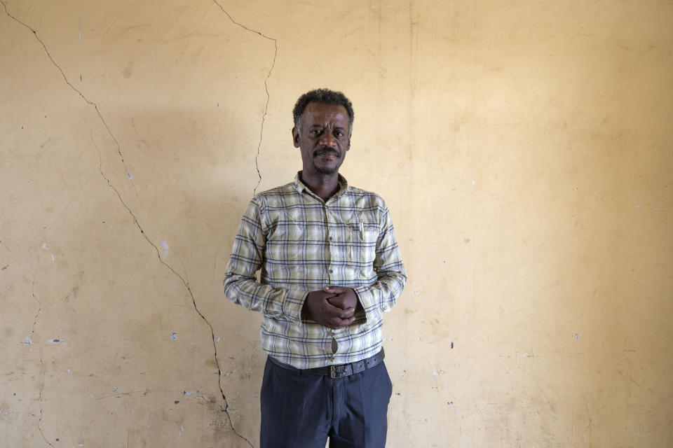 Surgeon and doctor-turned-refugee, Tewodros Tefera, stands for a photograph in the Hamdeyat Transition Center near the Sudan-Ethiopia border, eastern Sudan, Tuesday, Dec. 15, 2020. For Tewodros, the conflict has been one civilian casualty after another since shelling began in early November as he worked at a hospital in Humera. Some shelling came from the north, he said, the direction of nearby Eritrea. (AP Photo/Nariman El-Mofty)