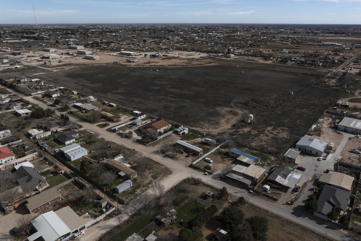 A playa (flood plain) borders a neighborhood in South Midland on Thursday, Feb. 1, 2024. For three years, residents from the neighborhood outside city limits consumed well water laced with traces of arsenic. The well can be seen in the bottom right of the flood plain.