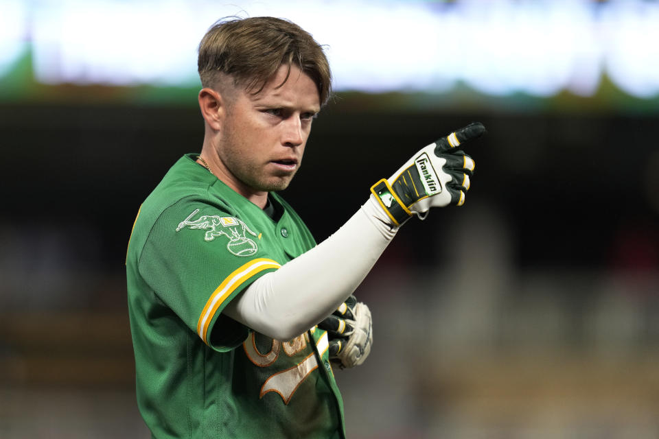 Oakland Athletics' Nick Allen points to the dugout after hitting a triple during the sixth inning of a baseball game against the Minnesota Twins, Wednesday, Sept. 27, 2023, in Minneapolis. (AP Photo/Abbie Parr)