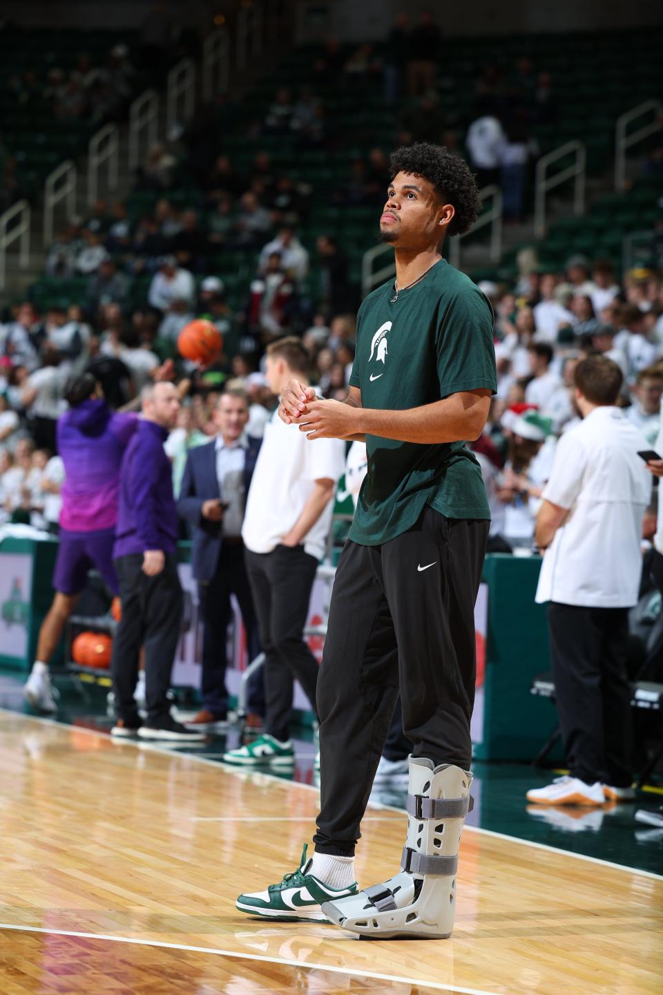 Injured Michigan State forward Malik Hall looks on during warmups before team's 70-63 loss against the Northwestern Wildcats at Breslin Center on Dec. 4, 2022 in East Lansing, Michigan.