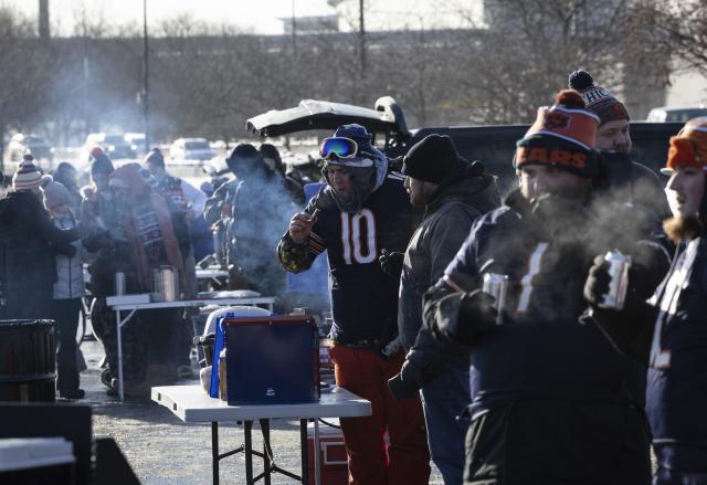 Fans hustle to get to warm after frigid Chicago Bears game at Soldier Field  on Christmas Eve