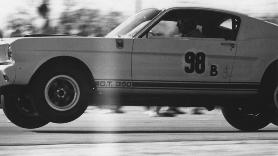 Ken Miles catching air with the Shelby GT350R prototype. - Credit: Photo: Courtesy of Mecum Auctions.