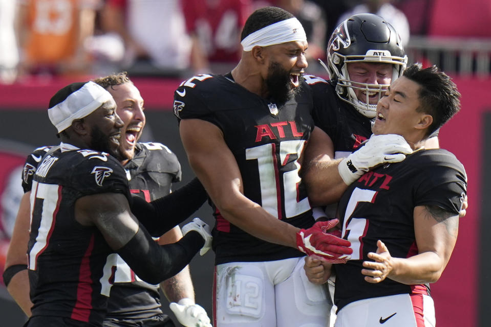 Atlanta Falcons place kicker Younghoe Koo, of South Korea, right, celebrates kicking the game-winning field goal against the Tampa Bay Buccaneers during the second half of an NFL football game, Sunday, Oct. 22, 2023, in Tampa, Fla. (AP Photo/Chris O'Meara)