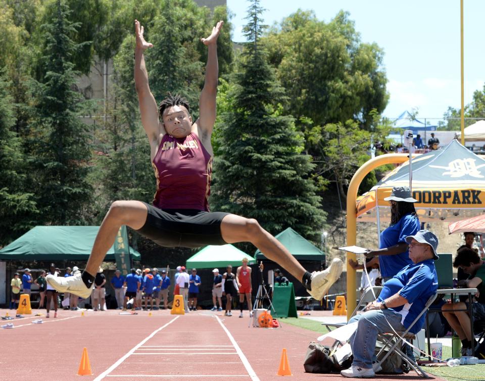 Joey Nations of Simi Valley gets some serious hang time in the Division 2 boys long jump competition during the CIF-Southern Section Track and Field Championships at Moorpark High on Saturday, May 14, 2022. Nations finished third.