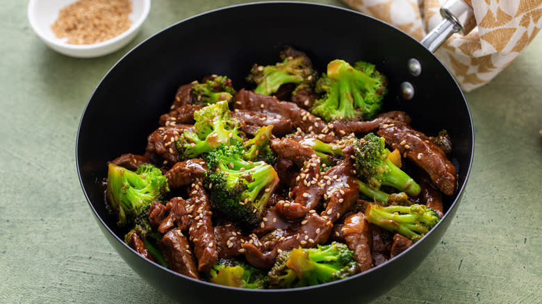 beef and broccoli and bowl of seasoning