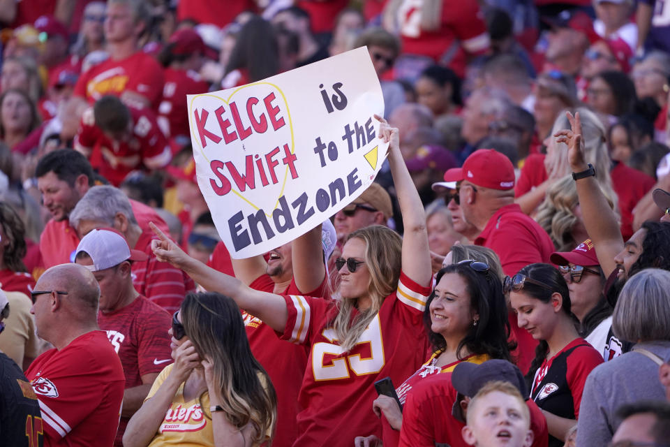 FILE - A fan holds a sign during the first half of an NFL football game between the Chicago Bears and Kansas City Chiefs Sunday, Sept. 24, 2023, in Kansas City, Mo. Eager as the National Football League has been to cater to the recent public fixation with Taylor Swift and Travis Kelce, it’s certainly not taking any credit for creating the "situationship" between the pop superstar and the Kansas City Chiefs tight end.(AP Photo/Ed Zurga, File)