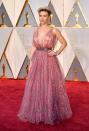 <p>Scarlett Johansson wore a whimsical feminine print pink gown attending the 2017 Oscars.</p>