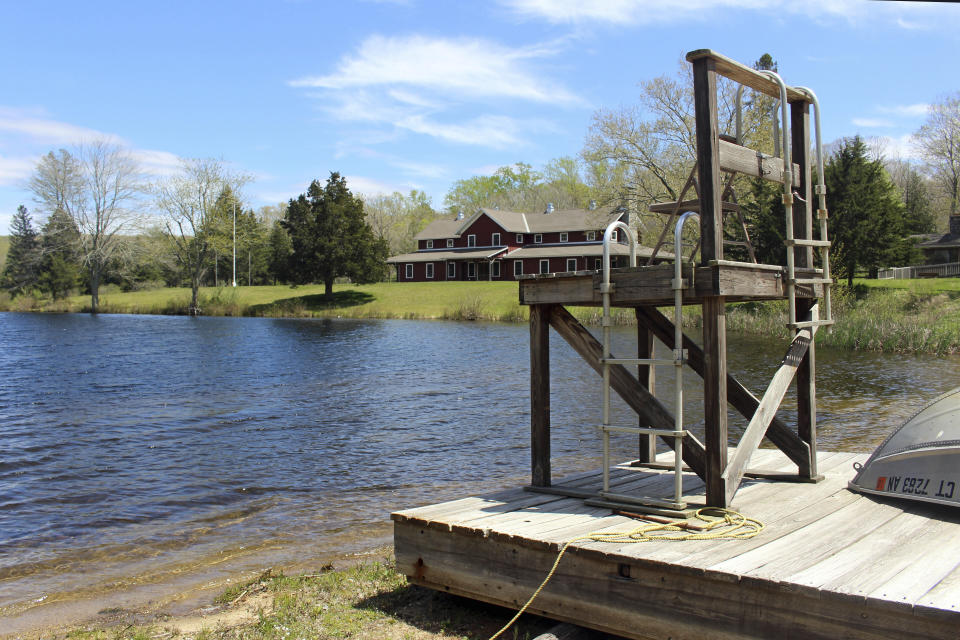 The Deer Lake Boy Scout Reservation in Killingworth, Conn., sits empty, Wednesday, May 11, 2022. The camp is among many nationwide being sold by local councils as membership dwindles and the organization raises money to pay sexual abuse victims as part of a bankruptcy settlement. Conservationists, government officials and others are scrambling to find ways to preserve them as open space. (AP Photo/Pat Eaton-Robb)