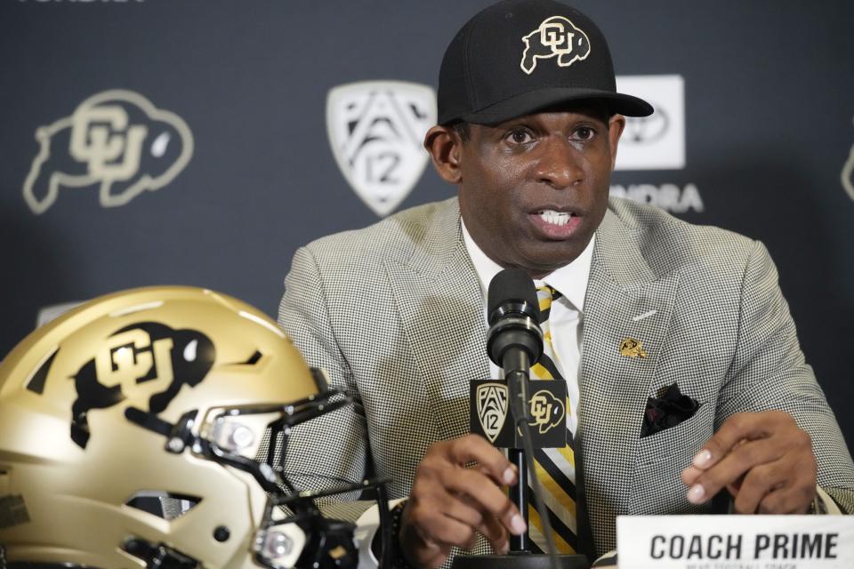 Deion Sanders speaks after being introduced as the new head football coach at the University of Colorado during a news conference.